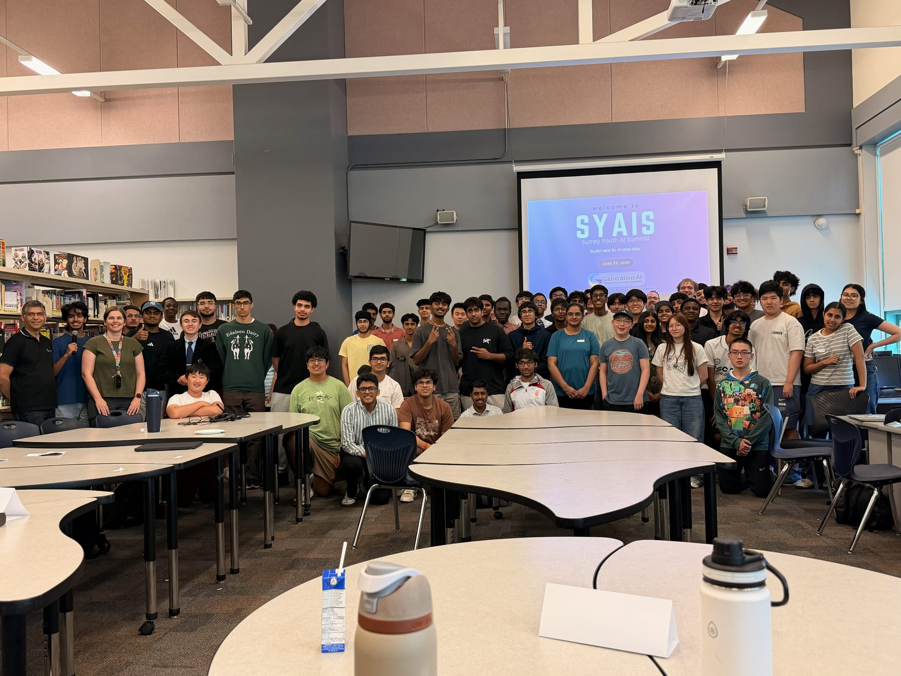 Group photo of about 70 students at the Surrey Youth AI Summit, June 23, 2026